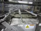 Used KHS Kisters, Model 601P Tray Shrink Wrap Bundler for printed film with 24 in. x 10 ft. x 15 in. High Shrink Tunnel. Has Allen-Bradley Logix 5555 PLC and Panelview 550 touch screen controls. Elec...