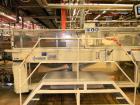 Used-Kisters 198/60 DZ Shrink Wrapper including infeed, outlet conveyors and magazine for carton pads.  For PET bottles 17, ...