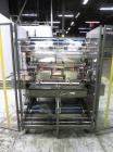 Used Omega Design Model DL-36 Dual Lane High Speed Shrink Bundler. Capable of speeds from 200 - 240 containers per minute. Is of stainless steel construction. Max product height: up to 11