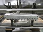 Used Omega Design Model DL-36 Dual Lane High Speed Shrink Bundler. Capable of speeds from 200 - 240 containers per minute. Is of stainless steel construction. Max product height: up to 11
