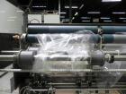Used Omega Design Model DL-36 Dual Lane High Speed Shrink Bundler. Capable of speeds from 200 - 240 containers per minute. Is of stainless steel construction. Max product height: up to 11