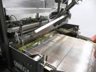 Used Omega Design Model DL-36 Dual Lane High Speed Shrink Bundler. Capable of speeds from 200 - 240 containers per minute. Is of stainless steel construction. Max product height: up to 11