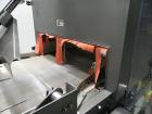 Used Omega Design Model DL-36 Dual Lane High Speed Shrink Bundler. Capable of speeds from 200 - 240 containers per minute. Is of stainless steel construction. Max product height: up to 11