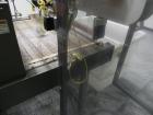 Used Omega Design Model DL-36 Dual Lane High Speed Shrink Bundler. Capable of speeds from 200 - 240 containers per minute. Is of stainless steel construction. Max product height: up to 11