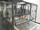 Used Omega Design Model DL-36 Dual Lane High Speed Shrink Bundler. Capable of speeds from 200 - 240 containers per minute. Is of stainless steel construction. Max product height: up to 11