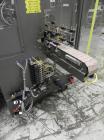Used Omega Design Model DL-36 Dual Lane High Speed Shrink Bundler. Capable of speeds from 200 - 240 containers per minute. Is of stainless steel construction. Max product height: up to 11