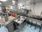 Used Omega Design Model DL-27 Dual Lane Shrink Bundler. Machine is capable of speeds from 200 to 240 bottles per minute (depending on product size and infeed pattern). Designed for dual main product ...