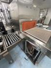 Used Omega Design Model DL-27 Dual Lane Shrink Bundler. Machine is capable of speeds from 200 to 240 bottles per minute (depending on product size and infeed pattern). Designed for dual main product ...