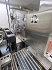 Used Omega Design Model DL-27 Dual Lane Shrink Bundler. Machine is capable of speeds from 200 to 240 bottles per minute (depending on product size and infeed pattern). Designed for dual main product ...
