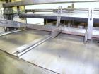 Used Omega Design Model DL-27 Dual Lane Shrink Bundler. Capable of speeds from 200 to 240 BPM (depending on product size and pattern). Has a Max film width of 26