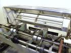 Used Omega Design Model DL-27 Dual Lane Shrink Bundler. Capable of speeds from 200 to 240 BPM (depending on product size and pattern). Has a Max film width of 26