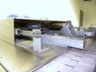 Used Omega Design Model DL-27 Dual Lane Shrink Bundler. Capable of speeds from 200 to 240 BPM (depending on product size and pattern). Has a Max film width of 26