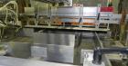 Used Omega Design Model DL-27 Dual Lane Multi-Pack Shrink Bundler. All stainless steel construction with Lexan type interlocked guarding. “Inline / Offset” infeed, utilizing single lane parallel dire...