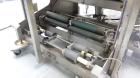 Used Omega Design Model DL-27 Dual Lane Shrink Bundler. All Stainless Steel constriction. Capable of speeds from 10-40 (20 cycles max)  bundles per minute, depending on configuration. Designed for du...