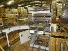 Used Omega Design Model SL-18 Shrink Bundler capable of speeds from 120 - 150 containers per minute depending on container size and pack pattern. Single lane unit with right angle infeed and integrat...