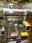 Used Omega Design Model SL-18 Shrink Bundler capable of speeds from 120 - 150 containers per minute depending on container size and pack pattern. Single lane unit with right angle infeed and integrat...