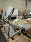 Used Omega Design Model SL-18 Shrink Bundler capable of speeds from 120 - 150 containers per minute depending on container size and pack pattern. Single lane unit with right angle infeed and integrat...