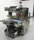 Used Omega Design Model SL-18 Single Lane Shrink Bundler. Machine is capable of speeds from 120 to 150 containers per minute. Has right angle infeed and integrated heat shrink tunnel. Has a maximum f...