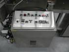Used Omega Design Model SL-18 Single Lane Shrink Bundler. Machine is capable of speeds from 120 to 150 containers per minute. Has right angle infeed and integrated heat shrink tunnel. Has a maximum f...