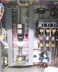 Used Omega Design Model SL-18 Single Lane Shrink Bundler. Machine is capable of speeds from 120 to 150 containers per minute. Has right angle infeed and integrated heat shrink tunnel. Has a maximum f...