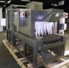 Used PMI Model SIC-30 Automatic Shrink Bundler & Shrink Tunnel. Machine is rated at up to 30 packages per minute. Tray wrapper has a30