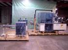 Used Skinetta ASK 450T Shrink Bander/Bundler. Capable of speeds from 10 to 40 cycles per minute. Has inline feed and optional right angle carton collator. Max 450mm web width. Has upstacker. Last use...
