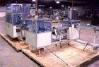 Used Skinetta ASK 450T Shrink Bander/Bundler. Capable of speeds from 10 to 40 cycles per minute. Has inline feed and optional right angle carton collator. Max 450mm web width. Has upstacker. Last use...