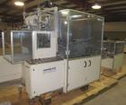 Used Skinetta ASK 450T Shrink Bander/Bundler. Capable of speeds from 10 to 40 cycles per minute. Has inline feed and optional right angle carton collator. Max 450mm web width. Has upstacker. Last use...