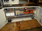 Used Skinetta ASK 450T Shrink Bander/Bundler. Capable of speeds from 10 to 40 cycles per minute. Has inline feed and optional right angle carton collator. Max 450mm web width. Has upstacker. Last use...