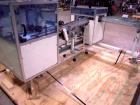 Used Skinetta ASK 450T Shrink Bander/Bundler. Capable of speeds from 10 to 40 cycles per minute. Has inline feed and optional right angle carton collator. Max 450mm web width. Has upstacker. Last use...
