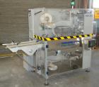 Used Skinetta Automatic Stretch Banding/ Shrink Bundle Machine, Model ASK200B, Serial #2517.02. Capable of speeds up to 20 cycles per minute. Will handle working film web width of 200 mm. Handles PE ...