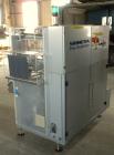 Used Skinetta Automatic Stretch Banding/ Shrink Bundle Machine, Model ASK200B, Serial #2517.02. Capable of speeds up to 20 cycles per minute. Will handle working film web width of 200 mm. Handles PE ...