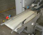 Used Skinetta Automatic Stretch Banding/ Shrink Bundle Machine, Model ASK200B, Serial #2517.02. Capable of speeds up to 20 cycles per minute. Will handle working film web width of 200 mm. Handles PE ...