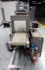 Used Skinetta (Christ Packaging) Model ASK300 Automatic single lane stretch/shrink film bundler. Capable of speeds up to 32 cycles per minute. Capable of a product size range (length) 75mm - 290mm (w...