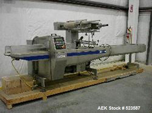 USED: Doboy Linium 305 horizontal shrink wrapper capable of speeds up to 200 packages per minute. Servo driven system, has 10' long infeed, static lap seam seal. Will handle most heat sealable shrink...