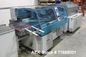 Used- Hugo Beck Full Shrink System; Includes: Infeed finger conveyor, tunnel SL 5015/23, exit flat belt conveyor. Dimensions...