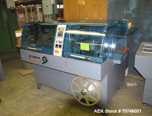 Used Hugo Beck Super Series 500 Shrink Film Packaging Machine.  All electric intermittent side seal machine.  19" Wide, 8" high cross seal opening, continuous rotary side seal, left to right flow, Si...