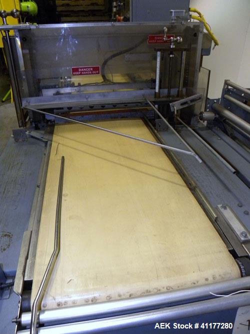 Used Shanklin Shrink Wrapper and Automatic L Bar Sealer With Side Sealer, Model CF-1, Carbon Steel. Fully automatic operation. Automatic package length adjustment. Up to 30 packages per minute. Packa...