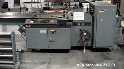 Used Shanklin F5 horizontal side seal shrink wrapper capable of speeds up to 75 packages per minute and 90 linear feet per minute. Minimum package size: width 1/2" to 16", length 3" to 48", height 1/...