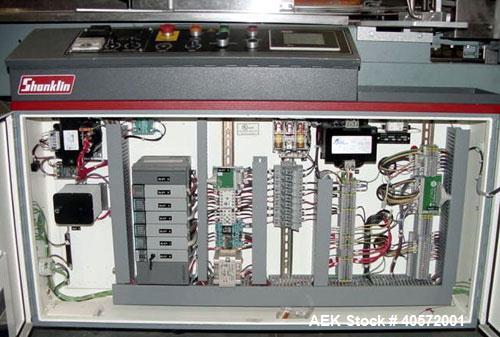 Used Shanklin F5 horizontal side seal shrink wrapper capable of speeds up to 75 packages per minute and 90 linear feet per minute. Minimum package size: width 1/2" to 16", length 3" to 48", height 1/...