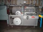 Used Used: Kallfass Universa 400 ST Fully Automatic Horizontal Side Seal Shrink Wrapper capable of speeds up to 85 cycles per minute. Unit includes scrap rewinder.
