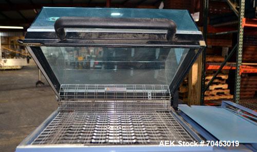 Used Babypack 1217 all in one shrink wrapper.  Capable of speeds from 4 - 6 packages per minute. Sealing dimensions: 12"W x 17"L x 6"H. Maximum center folded film: 14" Has impulse sire seal system. m...