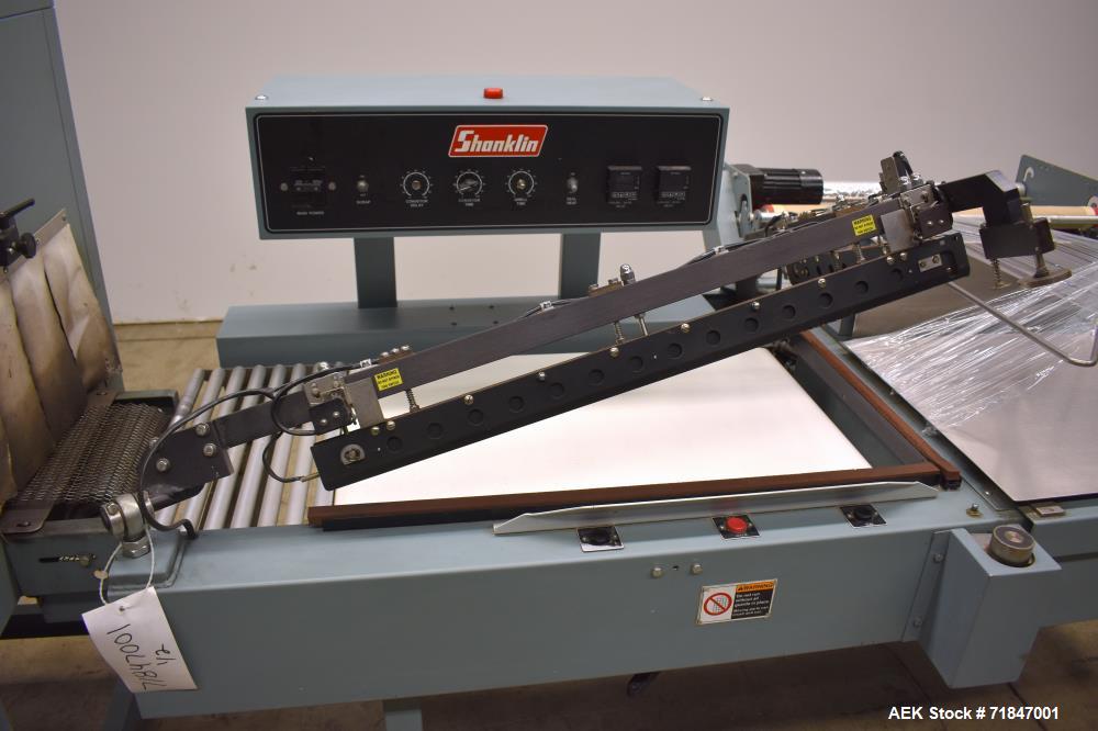 Used Shanklin Shrink Packager Model S24B with T6 Tunnel. Semi automatic inline L-Bar sealer rated from 1 to 20 packages per minute. 28" long x 23" wide load area; 33" long x 20" wide seal bar; up to ...