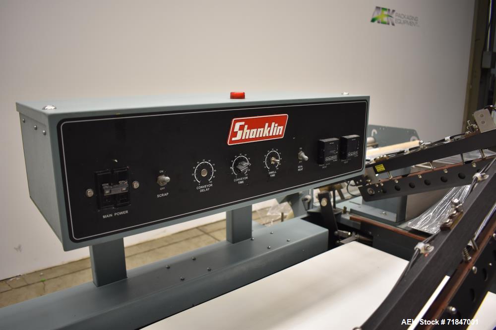 Used Shanklin Shrink Packager Model S24B with T6 Tunnel. Semi automatic inline L-Bar sealer rated from 1 to 20 packages per minute. 28" long x 23" wide load area; 33" long x 20" wide seal bar; up to ...