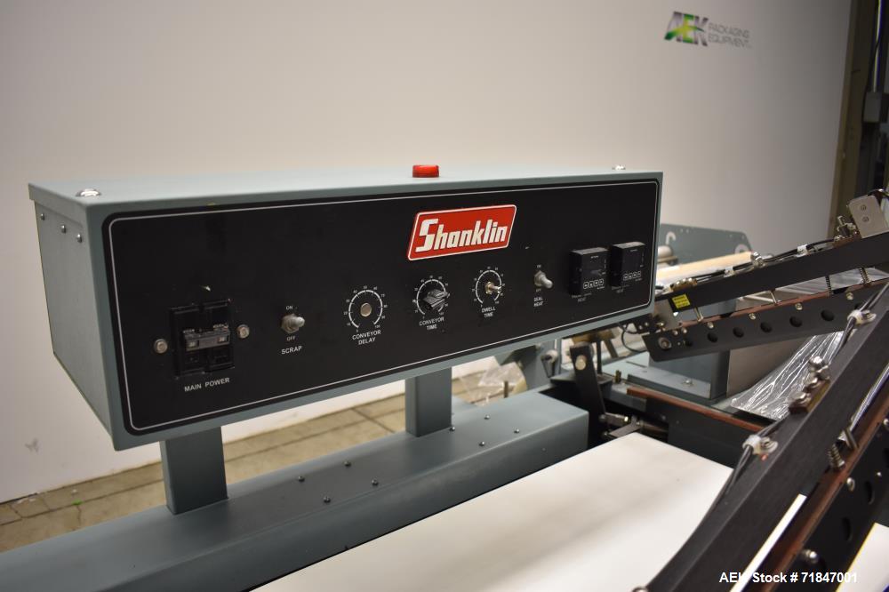 Used- Shanklin Shrink Packager Model S24B with T6 Tunnel. Semi automatic inline L-Bar sealer rated from 1 to 20 packages per...