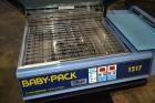 Used Babypack 1217 all in one shrink wrapper.  Capable of speeds from 4 - 6 packages per minute. Sealing dimensions: 12
