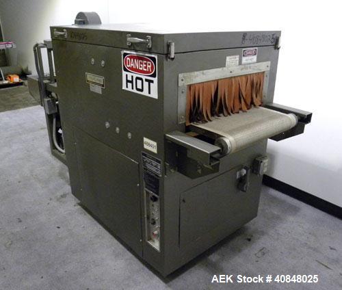 Used CAM Packaging Systems (CAMPAK) Versatunnel Shrink Tunnel, model VT238MB, carbon steel. 44" long shrink area. Infeed/discharge opening 23" wide x 7 1/2" high. 19 3/4" wide x 77" long mesh conveyo...