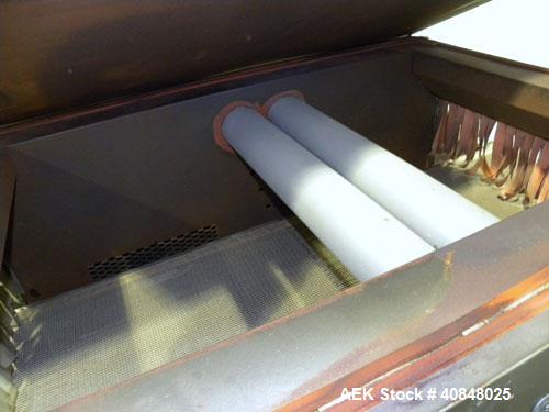 Used CAM Packaging Systems (CAMPAK) Versatunnel Shrink Tunnel, model VT238MB, carbon steel. 44" long shrink area. Infeed/discharge opening 23" wide x 7 1/2" high. 19 3/4" wide x 77" long mesh conveyo...