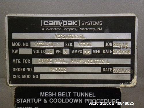 Used CAM Packaging Systems (CAMPAK) Versatunnel Shrink Tunnel, model VT238MB, carbon steel. 44" long shrink area. Infeed/discharge opening 23" wide x 7 1/2" high. 19 3/4" wide x 77" long mesh conveyo...