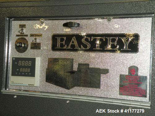 Used Eastey Enterprises Shrink Tunnel, model ET2012, carbon steel. Chamber size 20" wide x 12" high x 52" long. Wire mesh conveyor 19’’ wide x 72" long, belt speed 100 feet per minute. Includes a Aut...